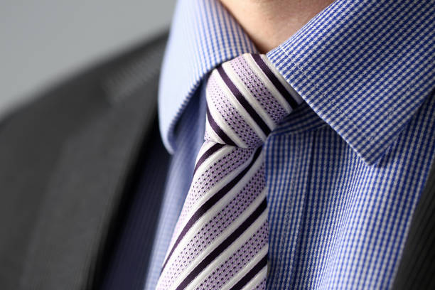 istock Business man in black suit set tie closeup 1092907098
