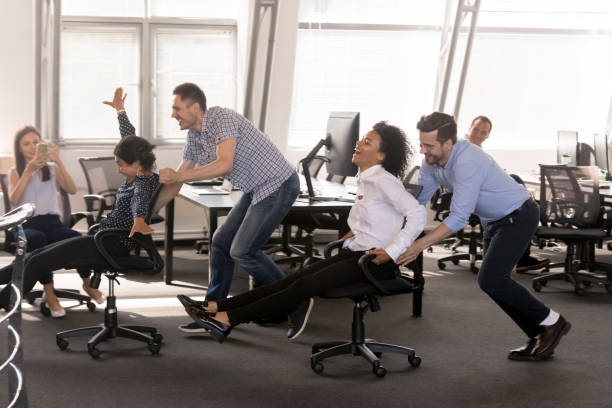 istock Excited diverse employees having fun together in office 1092907156