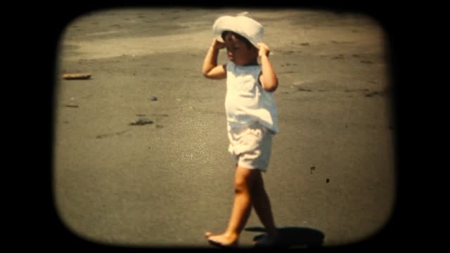 60's 8mm footage - Boy Splashing In the Sea