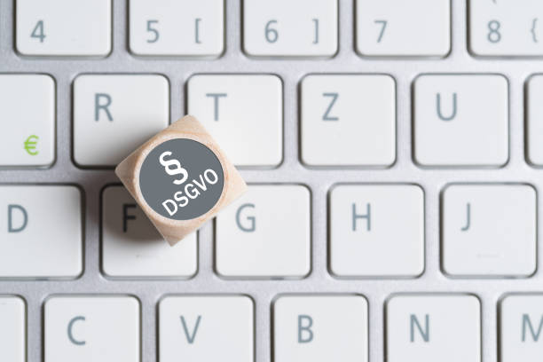 cube on a keyboard showing the German abbreviation for "GDPR" cube on a keyboard showing the German abbreviation for "GDPR" paragraph photos stock pictures, royalty-free photos & images