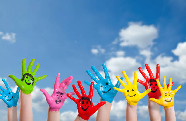 colorful painted hands - team human hand cheerful close up imagens e fotografias de stock