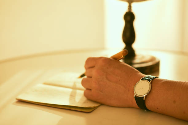 a pen on the middle page of an open book
