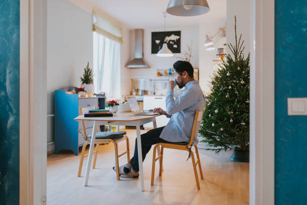 istock Single Japanese man does Christmas online shopping at home 1092924864