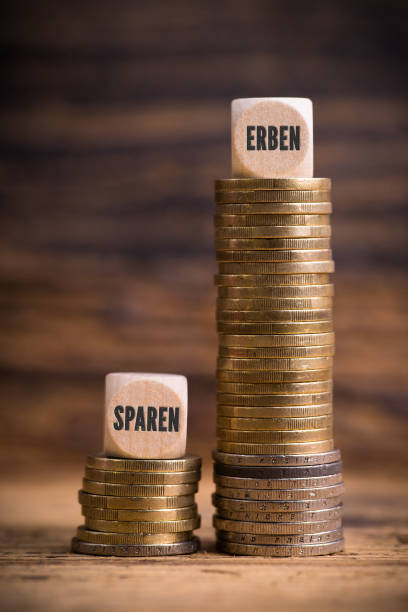 istock stacked coins showing unjust difference between saving money and inheriting it with the German words for 