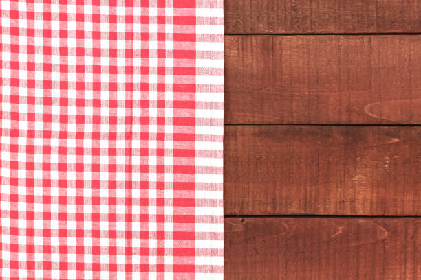 istock Wooden table and red tablecloth or napkin. Retro 1092928868