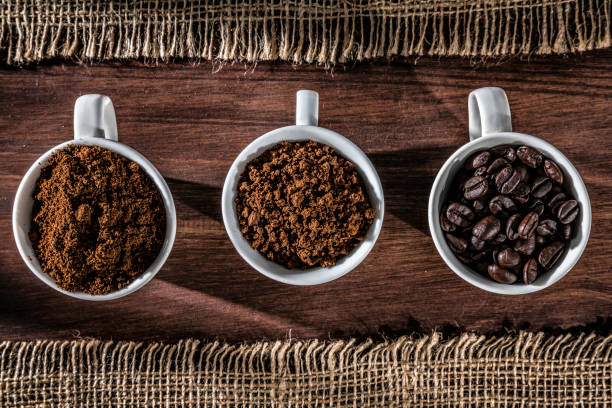 istock Three cups coffee beans, instant coffee and grinded coffee in jute frame 1092940342