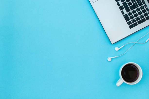 istock Laptop, headphones and coffee cup on a blue background. 1092944246