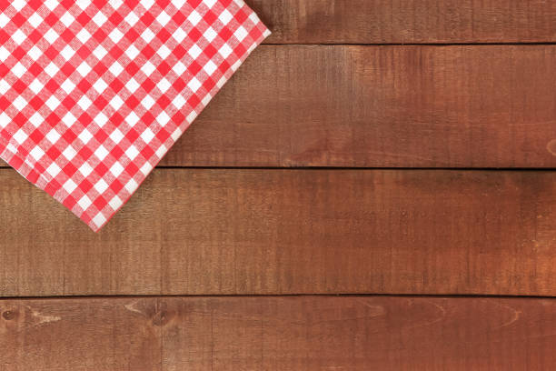 istock Wooden table and red tablecloth or napkin 1092944734