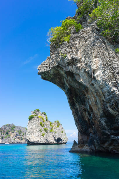 istock Rock in the sea at Phuket, Thailand. vertical 1092960220