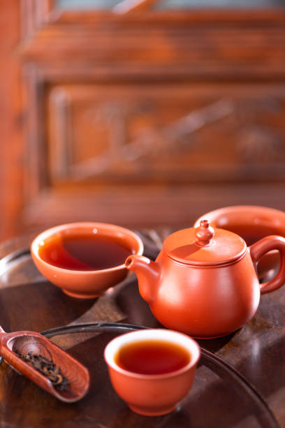 istock Chinese Purple Sand Teaware and tea on Wooden Table 1092968264