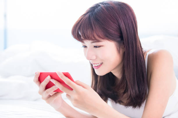 istock woman play mobile game 1092982290