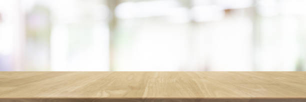 istock Empty wood table top and blurred restaurant interior banner background - can used for display or montage your products. 1092997656