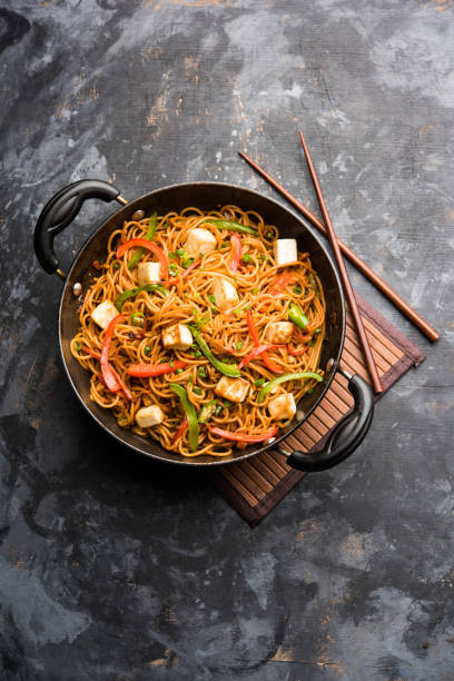 istock Schezwan hakka noodles with paneer or cottage cheese. Served in a bowl. selective focus 1092999252