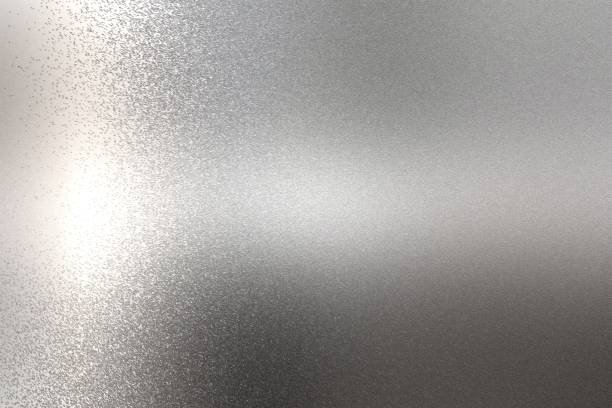 istock Light shining on rough chrome metal wall texture, abstract background 1093022144
