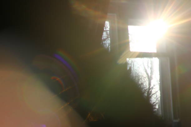 istock Abstract background - light color flashes and rays on black. Lens flare. 1093032334
