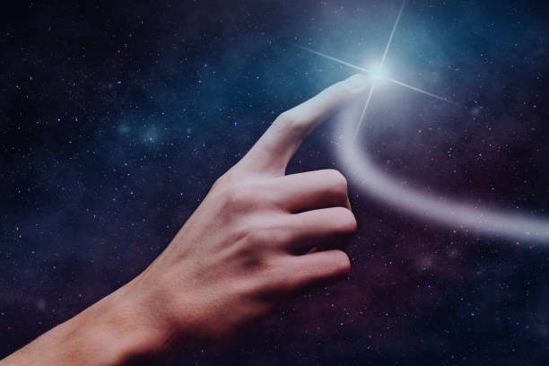 istock Forefinger touches a new star in infinite space. 1093034636