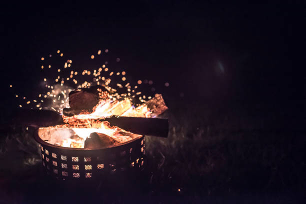 istock an outside fire with embers blowing in the wind 1093034856
