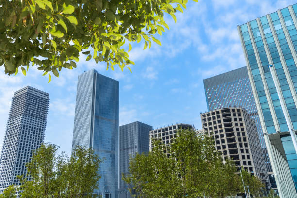 istock Business towers and Green leaves 1093036322
