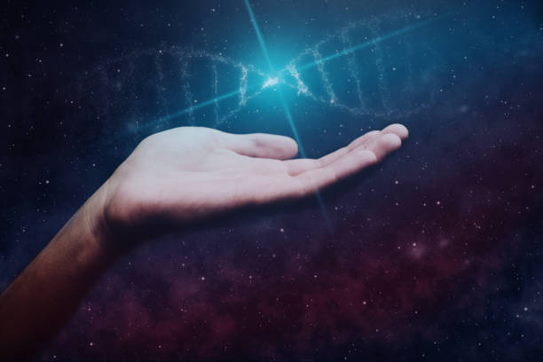 istock Close up of man Touching DNA molecule. Nebula dust in infinite space. Mixed media. 1093038358