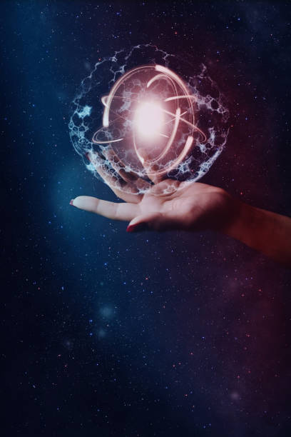 istock Woman hand holding cell dividing and atom. Nebula dust. Mixed media. 1093040744