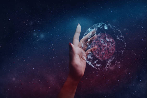 istock Woman hand holding cell dividing. Nebula dust. Mixed media. 1093045318