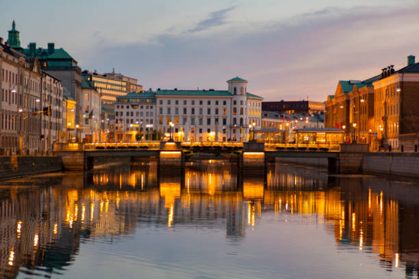 istock Scandinavian architecture building atnight with dramatic sky and reflection on water. 1093059404