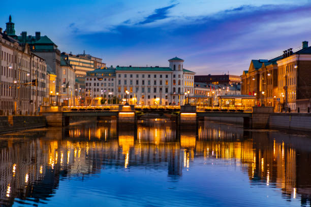 istock Scandinavian architecture building atnight with dramatic sky and reflection on water. 1093059416