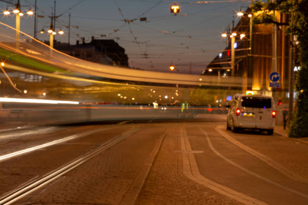 istock Light and traffic at night, long exposure and soft focus. Blurry beautiful urban district background, with tram on tract moving. 1093059786