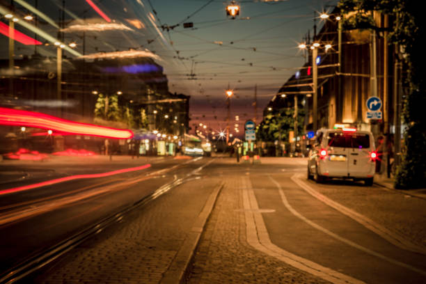 istock Light and traffic at night, long exposure and soft focus. Blurry beautiful urban district background, with tram on tract moving. 1093060446