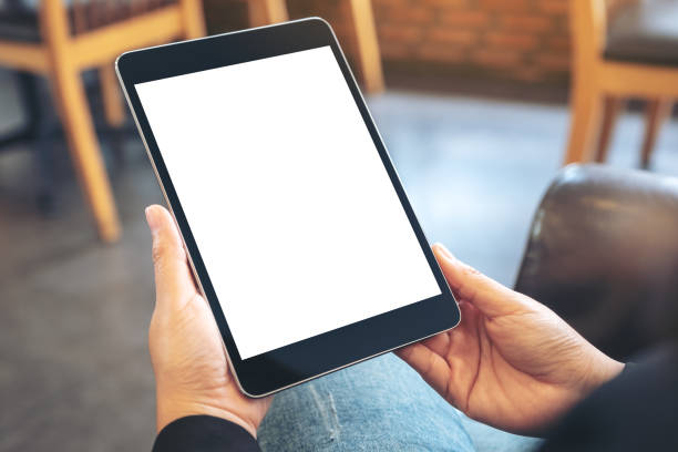 istock a woman holding black tablet pc with blank white screen 1093062102