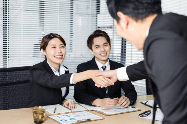 istock young business people handshaking in conference room 1093063222