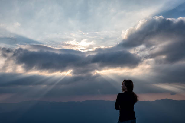 istock A beautiful asian woman standing and watching sunset 1093063708