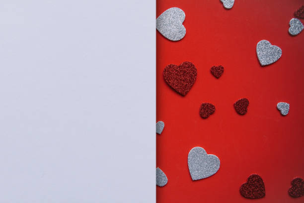 istock Many hearts on a red background and next to a place for text 1093069896