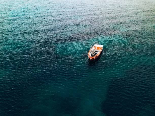 Photo of Aerial view of small fishing boat at sea, Greece.
