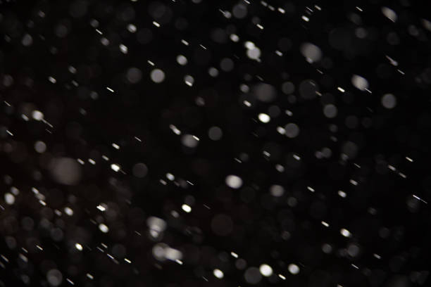 istock Background of falling snowflakes in the light of a lantern. 1093076308