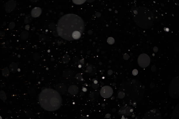istock Background of falling snowflakes in the light of a lantern. 1093076404