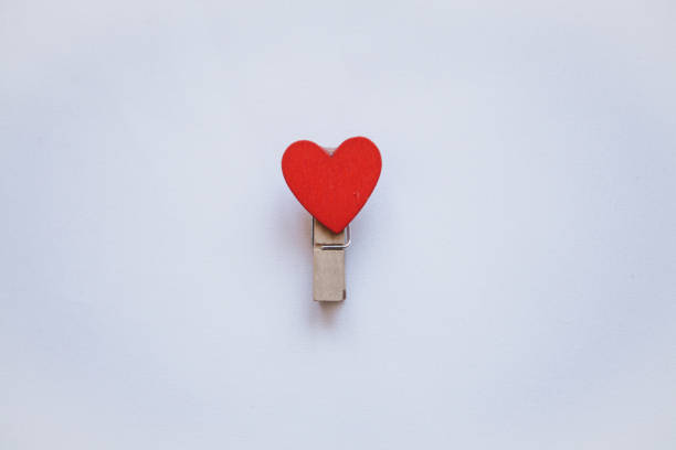istock Clothespin with a heart on a white background in a minimal style 1093077468