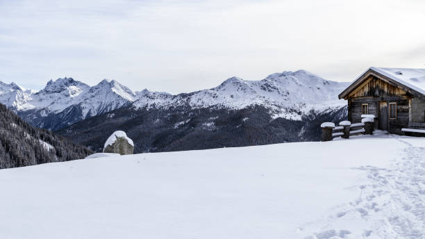 istock Alpine hut covered by the snow 1093085420