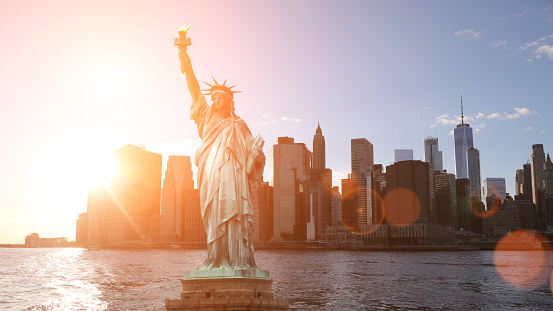 The Statue of Liberty with One World Trade Center Manhattan downtown skyline skyscrapers New York City USA