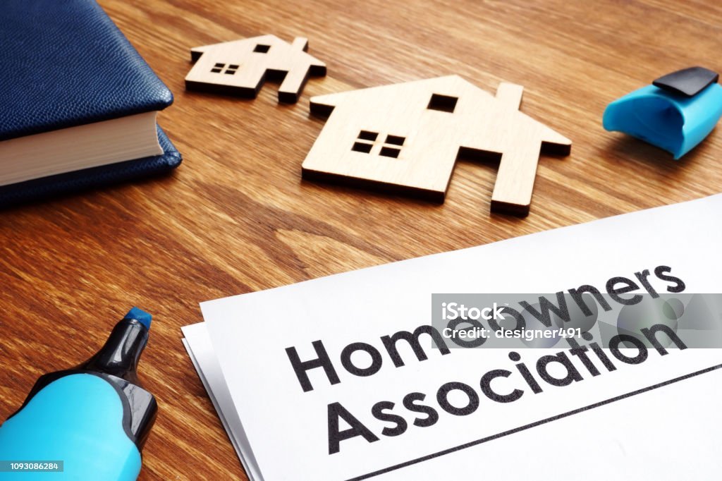 Documents about Homeowners Association HOA on a desk. Organized Group Stock Photo