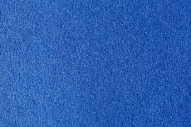 Photo of Close up aka macro shot of blue construction paper.