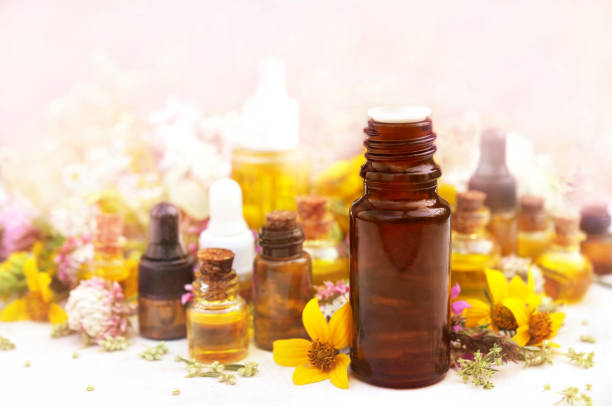 istock Essential oils on medicinal flowers and herbs background 1093095434