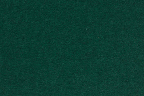 istock Dark green paper background. Grain texture art paper in a high resolution. 1093097896