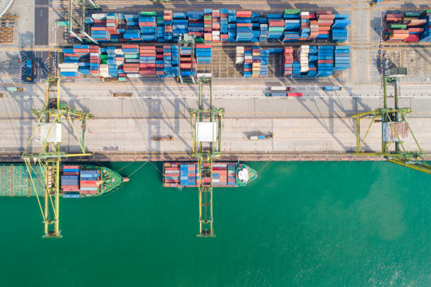 istock Logistics and transportation of Container Cargo ship and Cargo working crane bridge in shipyard 1093099032
