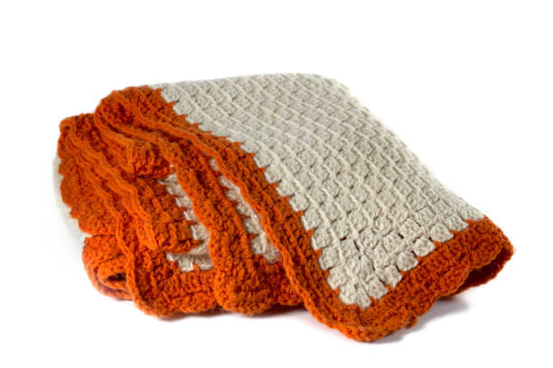 istock Orange and Cream Crochet Blanket 1093099058