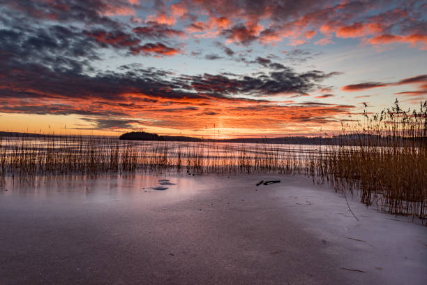 istock Sunset over frozen lake in Sweden 1093107502