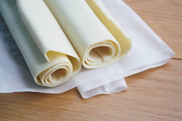 istock Puff pastry dough rolls on wooden table 1093139054