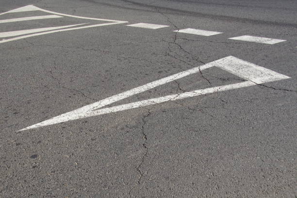 istock Road marking on cracked asphalt. 1093141372