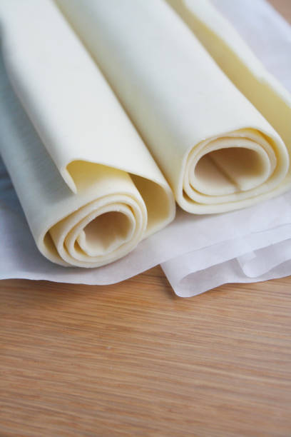 istock Puff pastry dough rolls on wooden table 1093141890