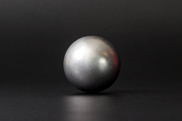 Metal ball bearings on black background